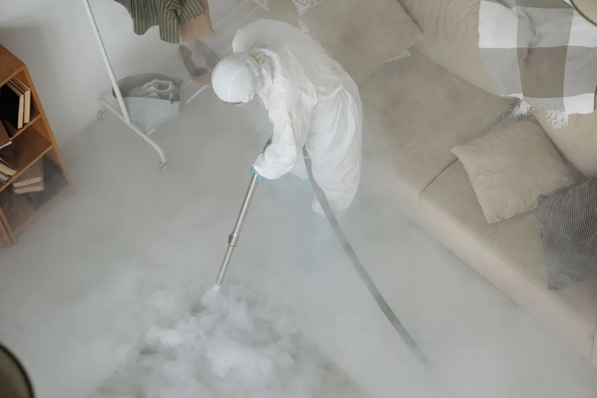 Biohazard cleanup technician in protective equipment, Port Vue, PA